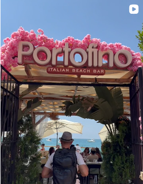 Portofino sign at the entrance with sea view
